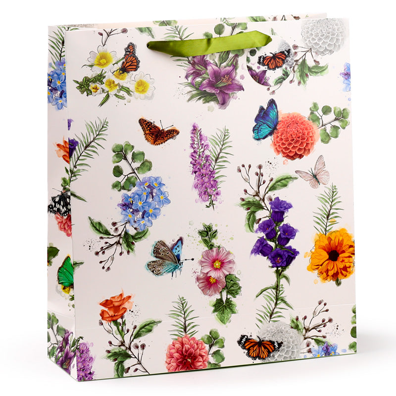 Gift bag with floral and butterfly design on a white background