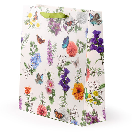 Floral and butterfly patterned gift bag on a white background