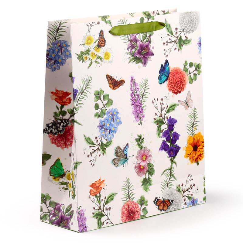Gift bag with floral and butterfly design on a white background