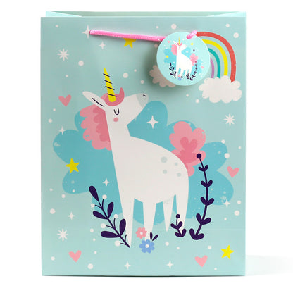 Gift bag with a unicorn design on a light blue background