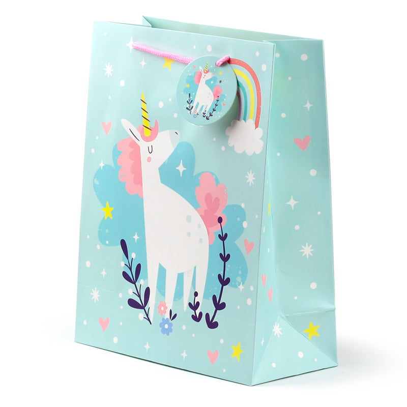 Gift bag with a unicorn design on a light blue background