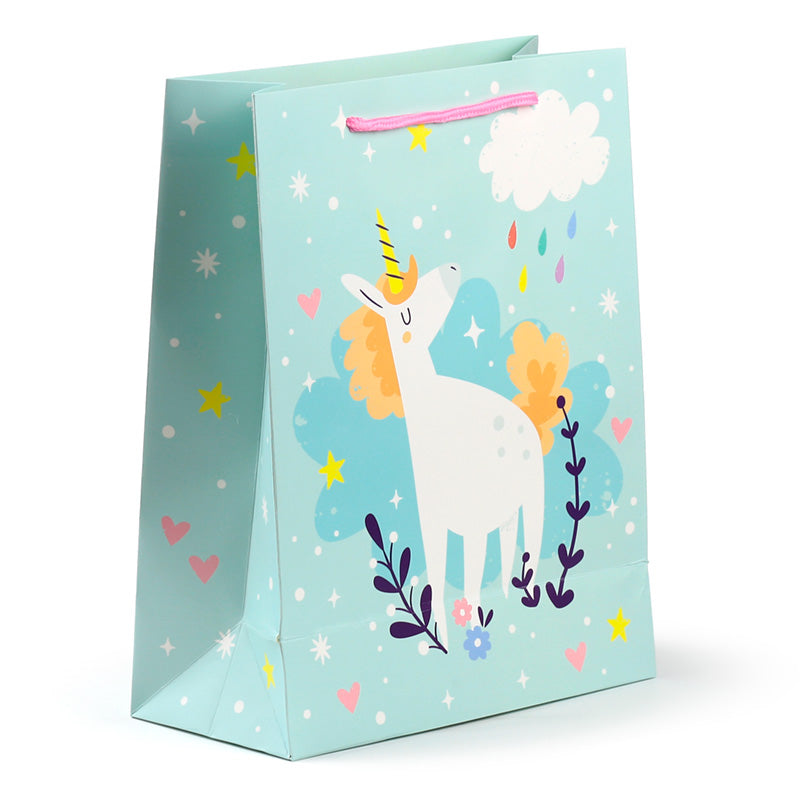 Gift bag with a unicorn design on a light blue background