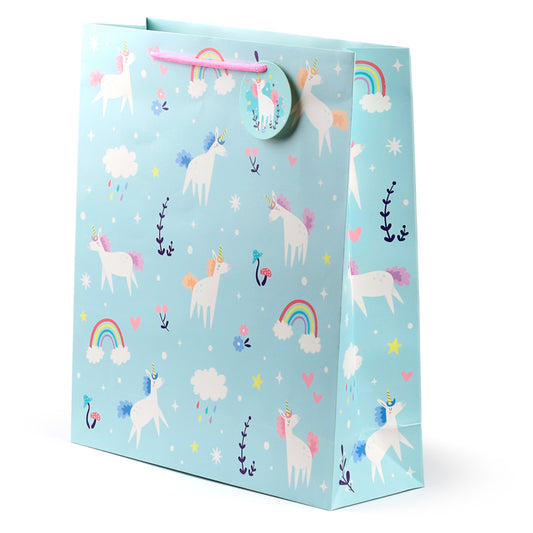 Gift bag with unicorn and rainbow design on a light blue background