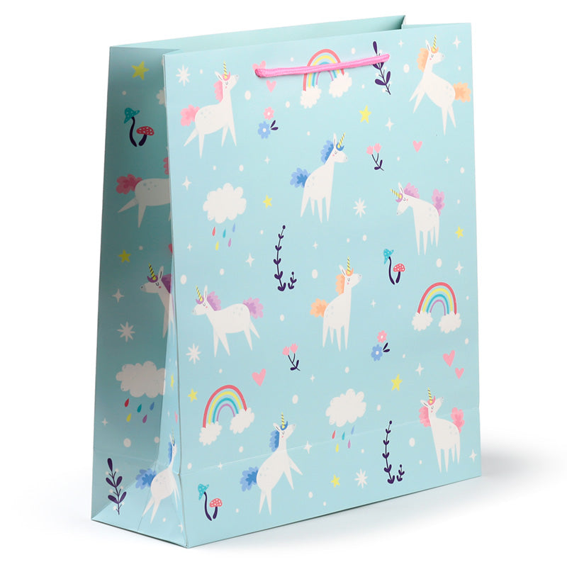 Gift bag with unicorn and rainbow pattern on a light blue background
