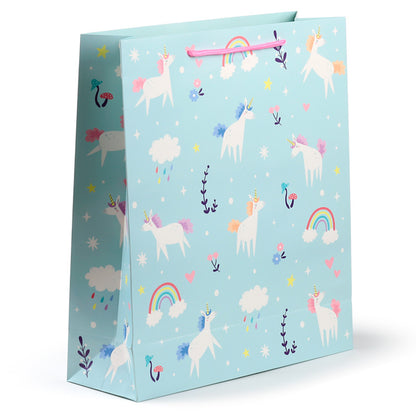 Gift bag with unicorn and rainbow pattern on a light blue background