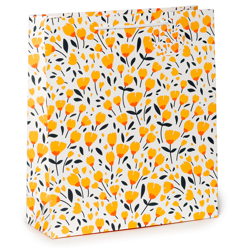 Floral patterned gift bag with yellow flowers and black leaves on a white background