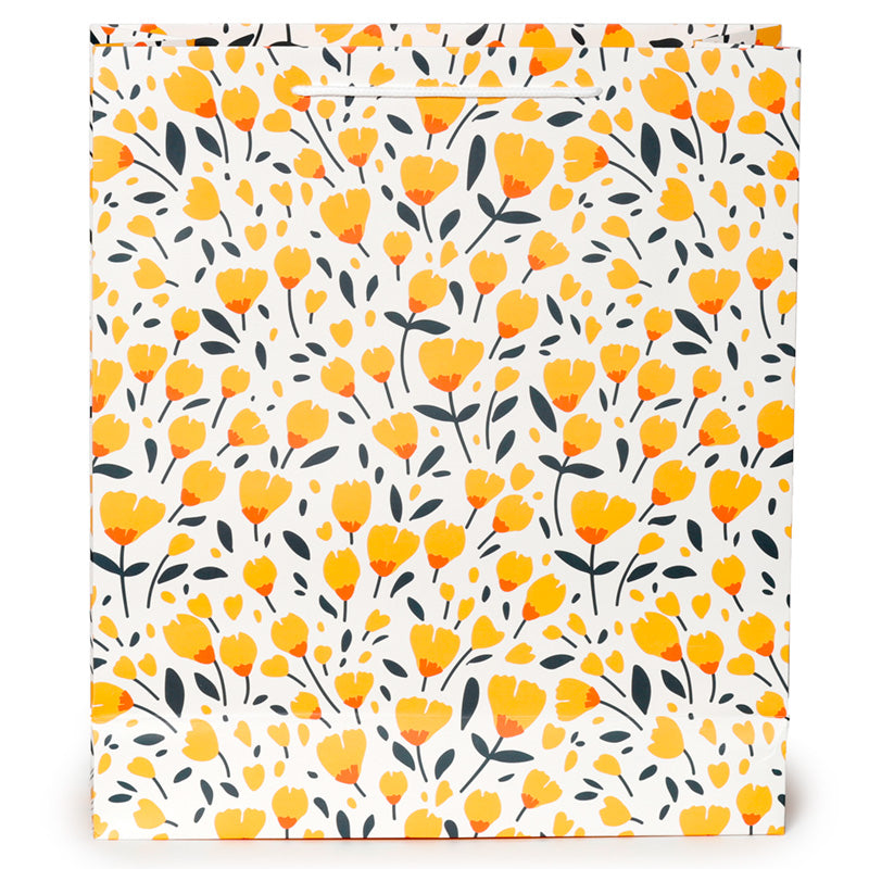 Floral patterned gift bag with yellow flowers and black leaves on a white background
