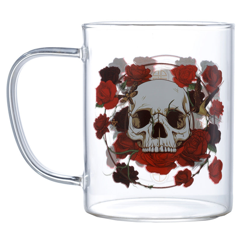 Clear glass mug with a skull and red roses design on a white background