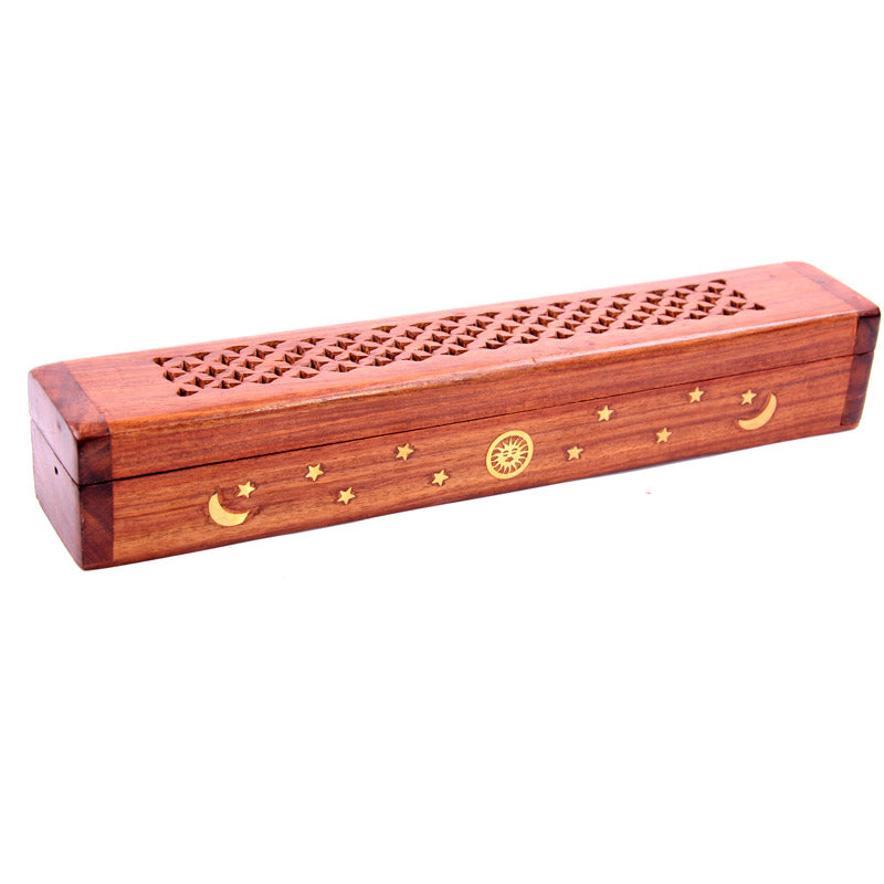 Wooden incense holder with star and moon designs on a white background