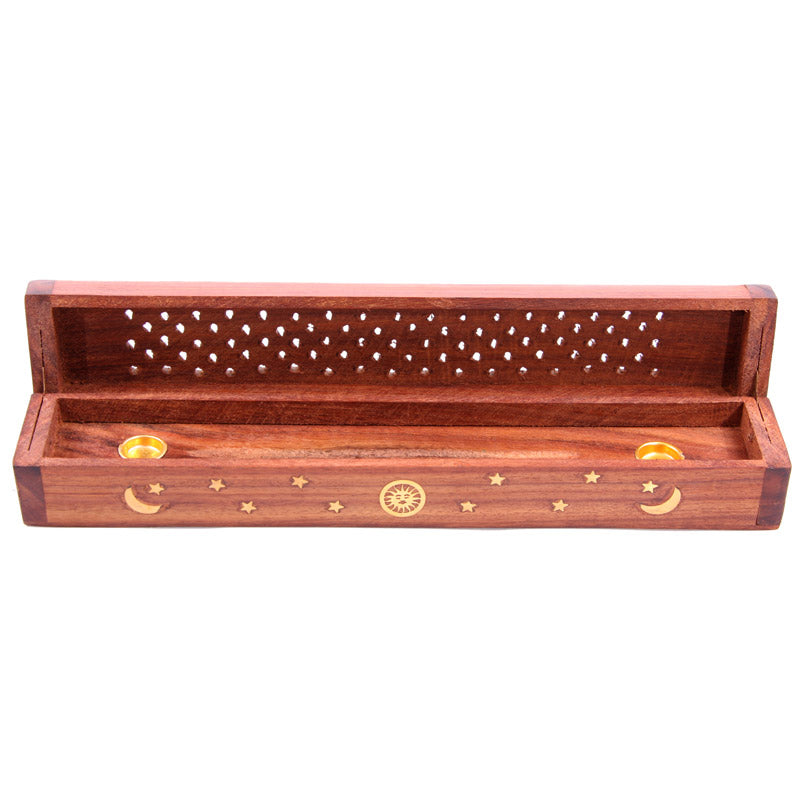 Wooden incense holder with star, moon, and sun designs on a white background