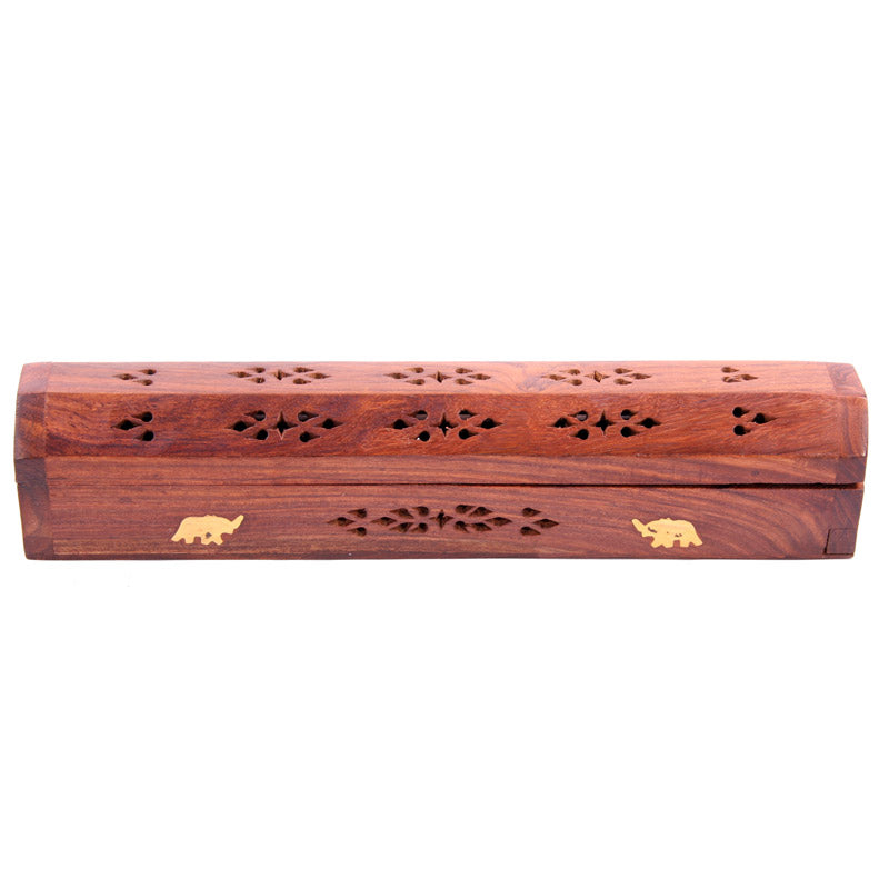 Wooden incense holder with elephant designs on a white background