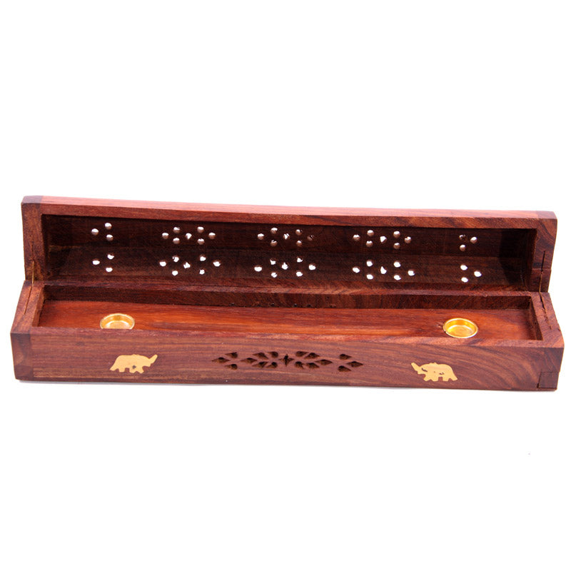 Wooden incense holder with elephant designs on a white background