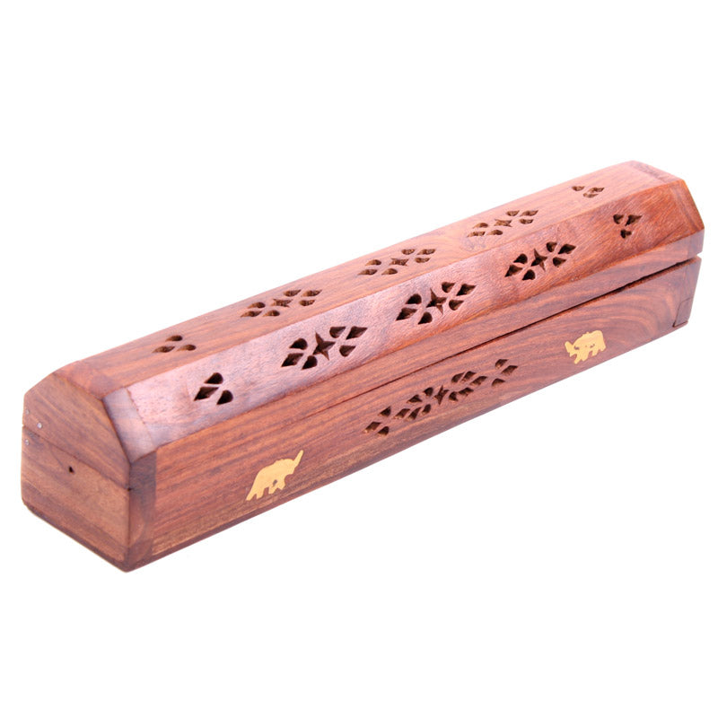 Wooden incense holder with decorative cutouts on a white background