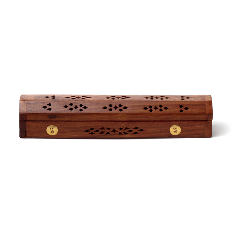 Wooden incense holder with decorative patterns on a white background