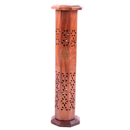 Wooden incense burner with floral patterns on a white background