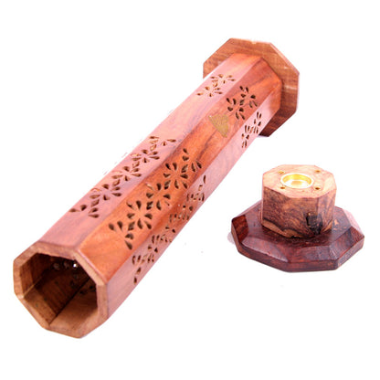 Wooden incense holder with intricate carvings on a white background