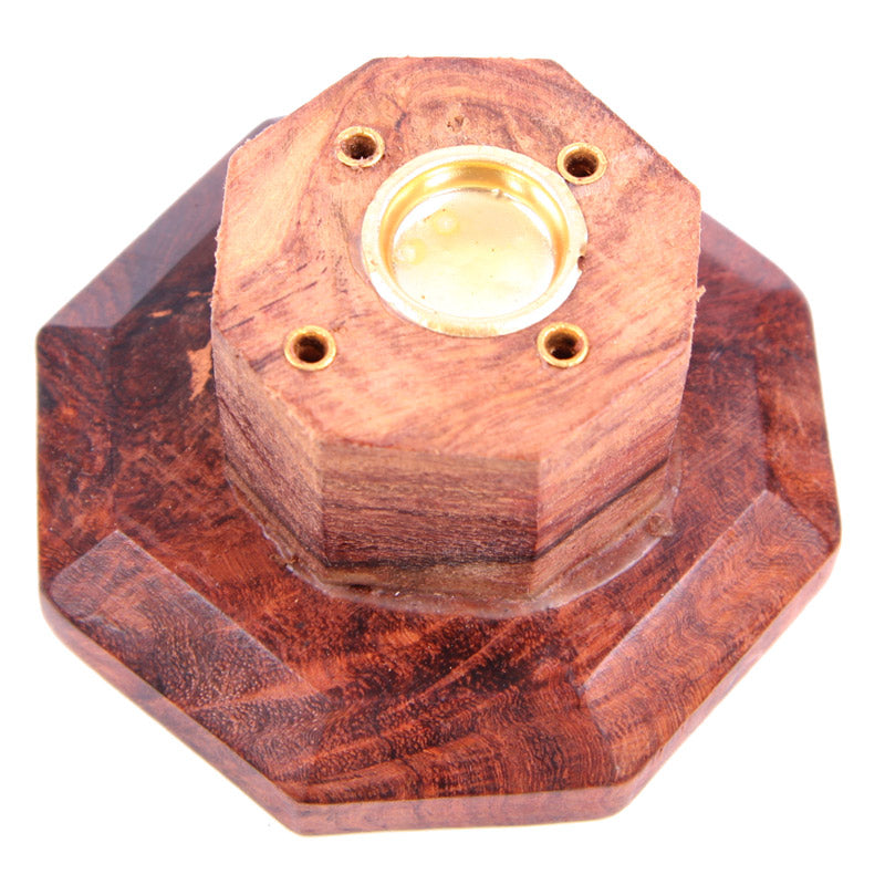 Wooden hexagonal object with a central gold-colored component on a white background