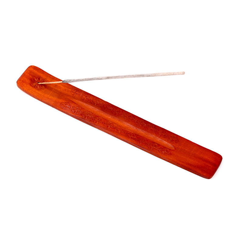 Red incense stick holder on a white background