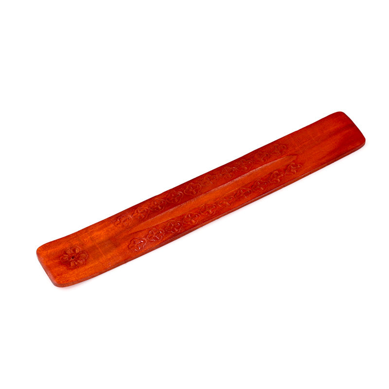 Red incense stick holder on a white background