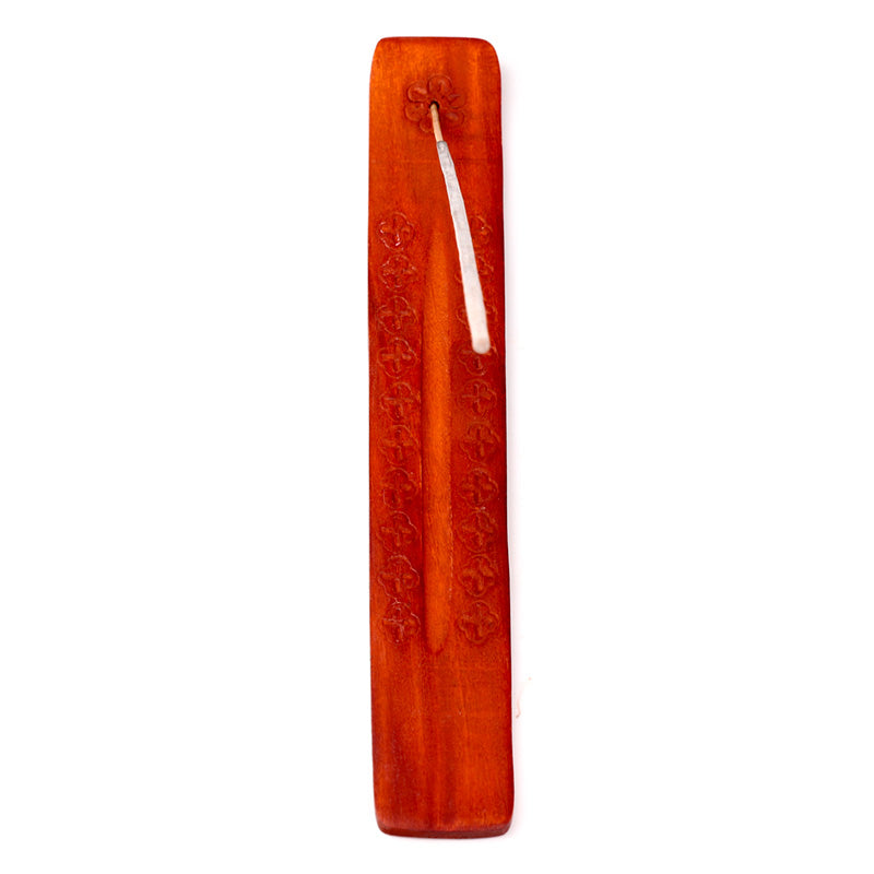 Red incense stick holder on a white background