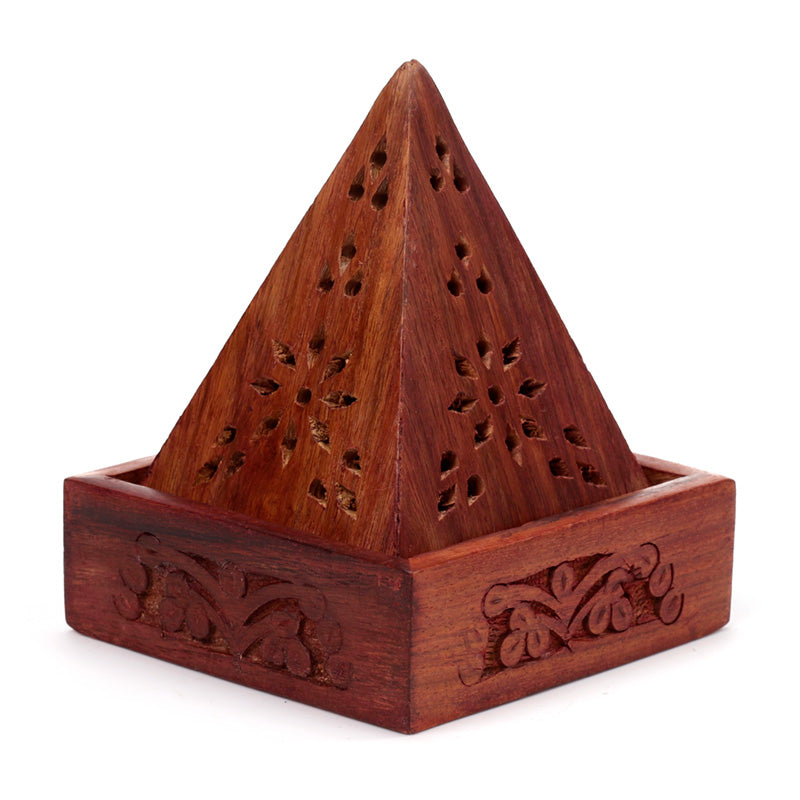 Wooden pyramid incense burner with intricate carvings on a white background