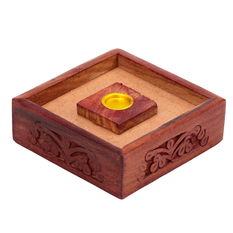 Wooden box with a decorative lid featuring a gold center on a white background
