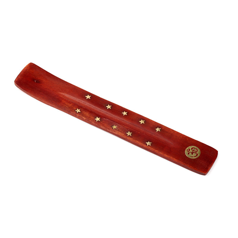 Wooden incense holder with star designs on a white background