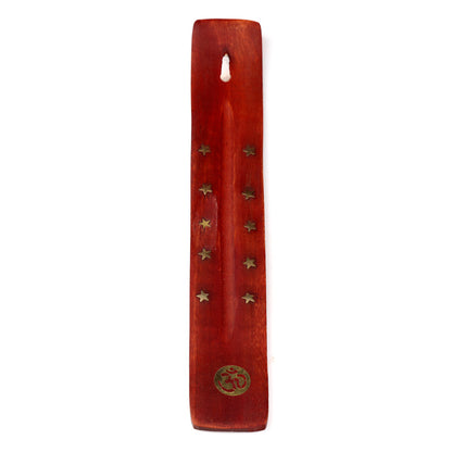 Wooden incense stick holder with star-shaped holes on a white background