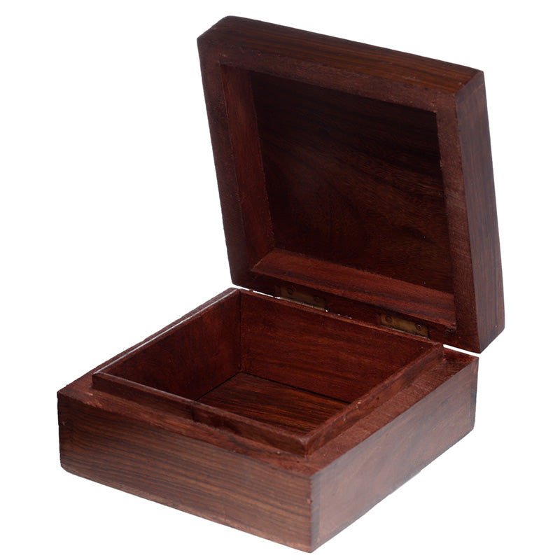 Wooden jewelry box with a lid open on a white background