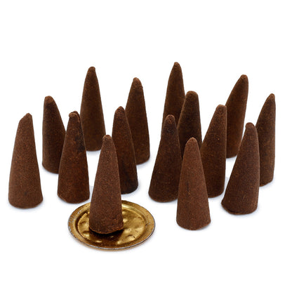 Brown incense cones with a gold base on a white background