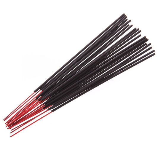 Black and red incense sticks on a white background