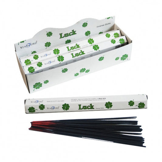 Incense sticks with 'Luck' packaging on a white background
