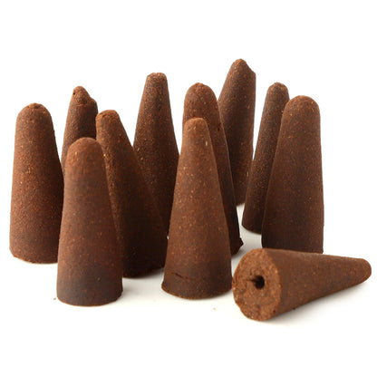Brown incense cones on a white background