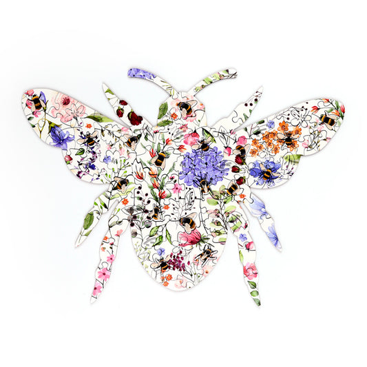 Colorful butterfly-shaped puzzle with floral and insect designs on a white background