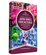 John Innes Ericaceous plant food packaging with colorful flowers on a white background