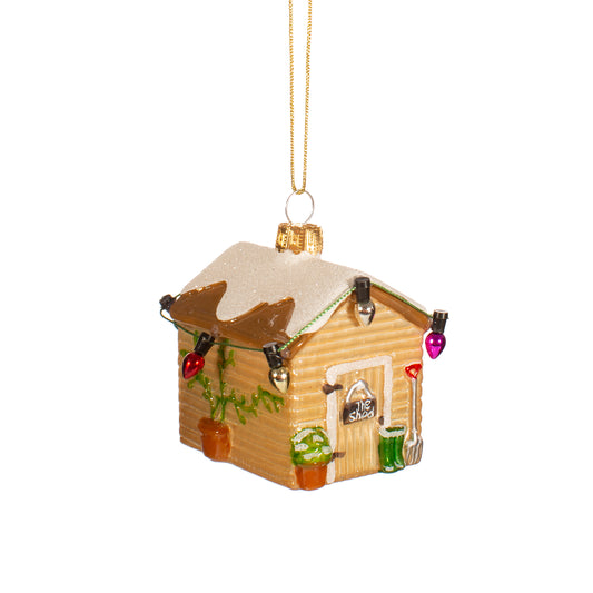 Decorative cabin ornament with lights on a white background
