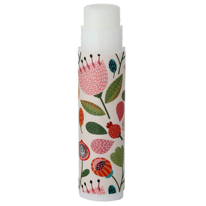 Lip balm with floral design on a white background