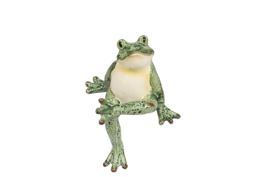 Frog-shaped night light on a white background
