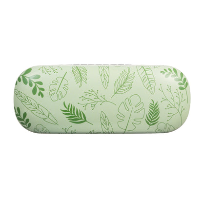 Green cylindrical pillow with leaf pattern on a white background