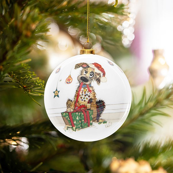 Christmas ornament with a dog and cat design on a tree