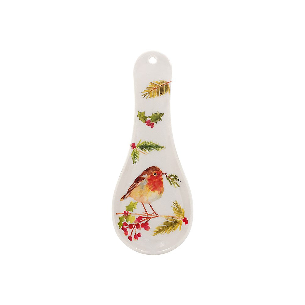 Decorative spoon rest with a bird and holly design on a white background