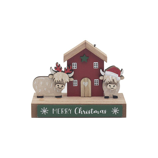 Decorative Christmas scene with two bulls, a house, and 'Merry Christmas' sign on a white background.
