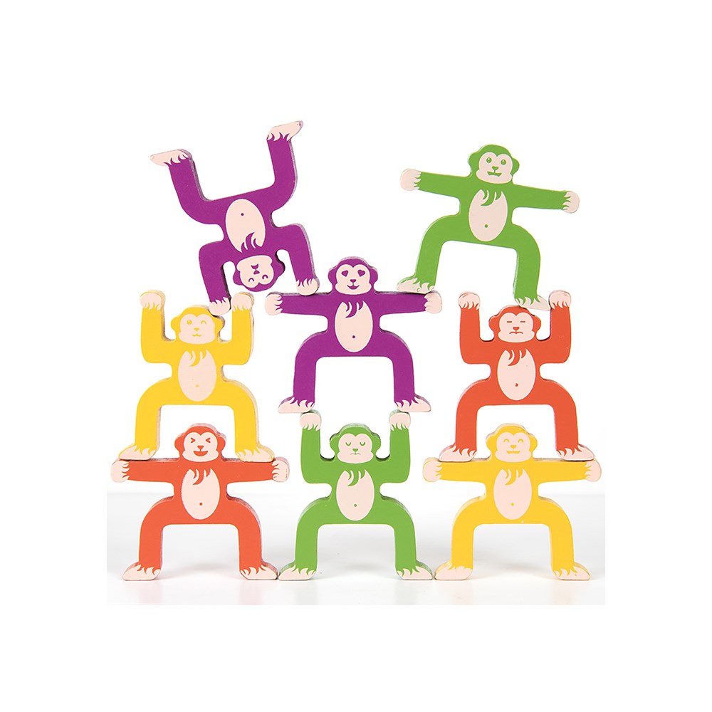Multiple coloured monkey toys on a white background
