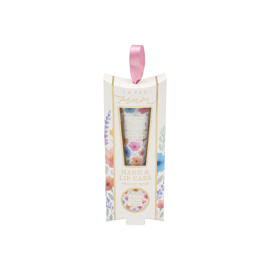 Hand and lip care set in floral packaging with a pink ribbon on a white background