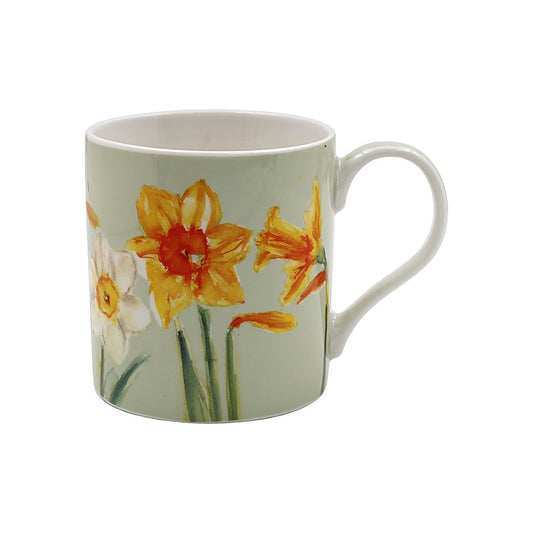 Mug with floral design featuring daffodils on a light green background