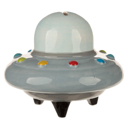 Toy UFO with colorful accents on a white background