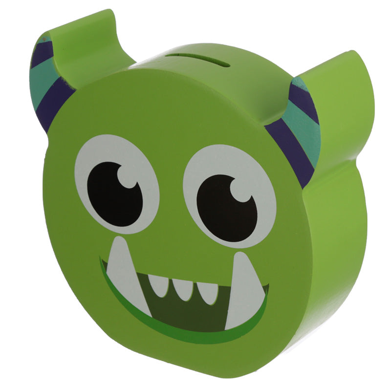 Green monster-shaped piggy bank with black eyes and a wide smile on a white background