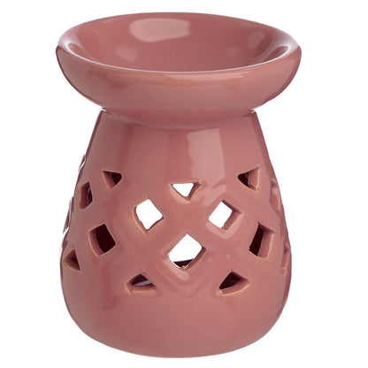 Pink ceramic oil burner with lattice design on a white background