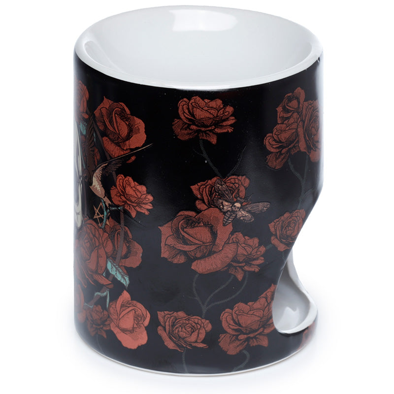Black mug with red floral design on a white background