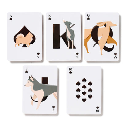 Set of playing cards with dog illustrations on a white background